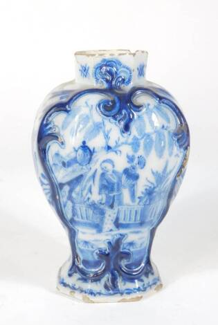 A Dutch Delft blue and white vase, c1800, decorated with continental figures, 20cm high.