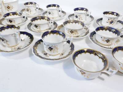 A part Staffordshire tea and coffee service, c1830, including coffee cups, tea cups and saucers, milk jug, decorated in blue and gilt. - 2