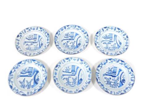 A set of six 18thC Chinese blue and white plates, decorated with oriental landscapes, 23cm diameter.