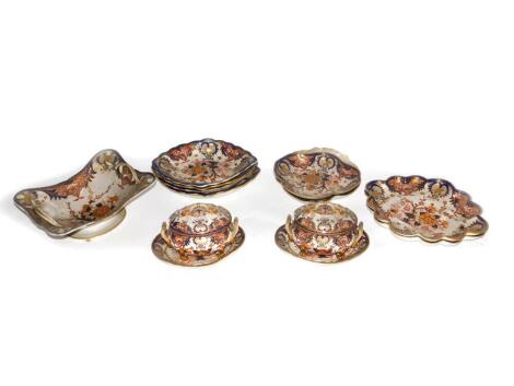 A part Derby dessert service, consisting of tureens, covers and stand, shell shaped dishes, baskets, lozenge dishes and scalloped shaped dishes, c1815. (15 pieces)