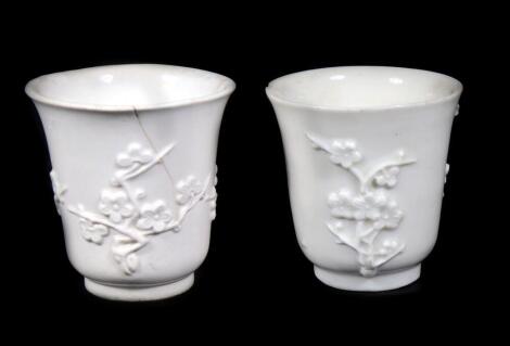 A pair of 19thC Chinese blanc de chine libation cups, 7.5cm high. (AF)