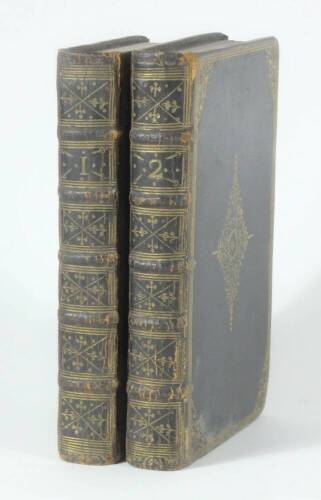 Fine English Binding.- Bible (English).- THE HOLY BIBLE CONTAINING THE OLD TESTAMENTS AND NEW..., 2 vol., fine contemporary black crushed morocco, ornately tooled in gilt, spines gilt, boards a little rubbed, 8vo, J. Basket, 1737.