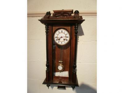 A 19thC German walnut drop dial wall clock with two part enamel dial and