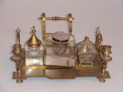 An Edwardian brass desk stand