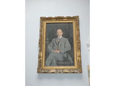 Reginald Grenville Eves (1876-1941). A portrait of Ernest Knightly Little in a seated three quarter length pose wearing a grey suit and bow tie, oil on canvas, signed and dated 1910, 116cm x 72cm. - 3