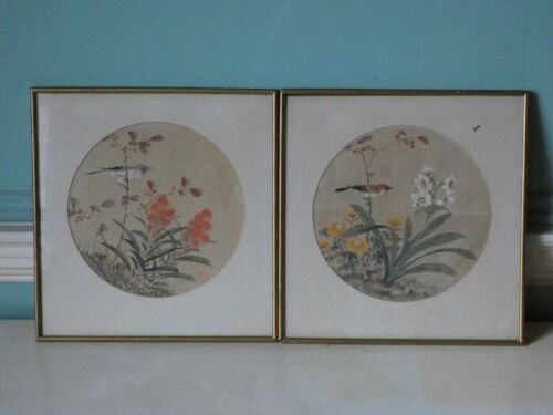 A pair of 20thC Chinese paintings on silk, depicting birds within flowering foliage and shrubs, 23.5cm diameter.