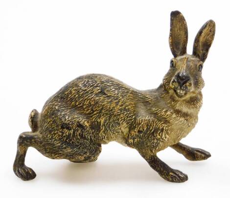 A late 19thC Austrian cold painted bronze model of a hare, in a slightly crouched stance and bearing its teeth, 9cm long, 7.5cm high.