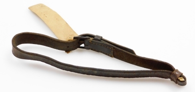 A 19thC leather strap reputed to have been worn by The Duke of Wellington at Waterloo, bearing a hand written label stating: This strap fastened The of Duke of Wellington's near side holsters at Waterloo, given me by O H Perry....from Strafield Saye, G H - 3