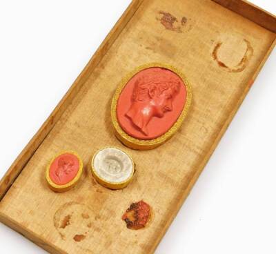 A collection of 18thC Grand Tour coral plaster cameos, depicting classical Roman figures, etc., contained in the original wooden box with a hand written inscription in Italian on paper applied to the lid. - 4