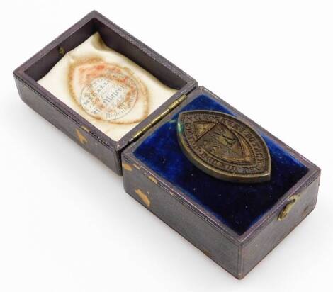 A Victorian bronze oval seal, with a shield crest of three crowns and crossed keys within Latin script, in a fitted case for B.Wyon, Medalist and Chief Engraver of Seals to Her Majesty, 287 Regent Street.