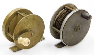 A 19thC brass winch type fishing reel, with ivory handle, 6.5cm diameter, and another brass and alloy fishing reel, 7cm diameter, (2).