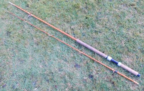 A mid 20thC two piece fibreglass salmon spinning rod, with bag.