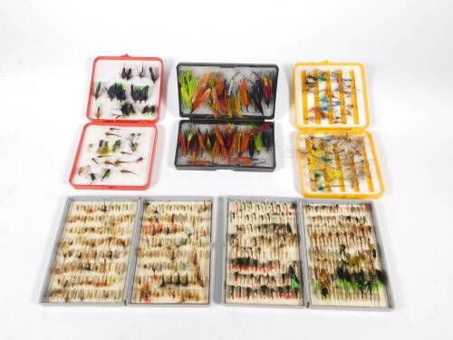 A collection of trout flies, including wet and dry flies, may flies, and Waddington salmon flies, together with the fly boxes.