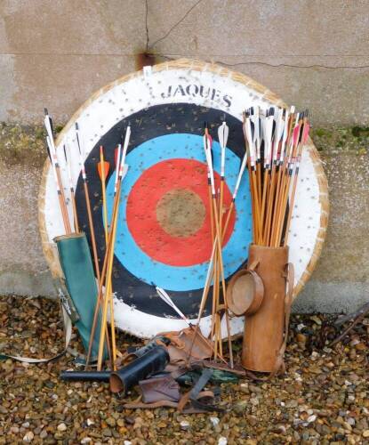 A Jaques archery target and a collection of arrows, quiver and accessories.
