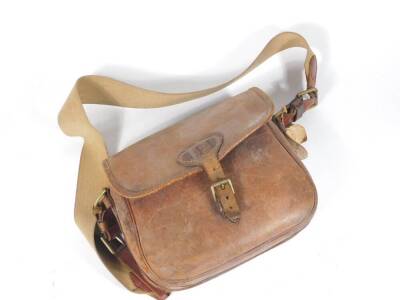 A vintage leather cartridge bag by Payne Gallwey, bears initials APL.