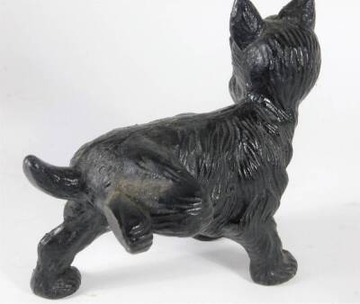 A modern cast iron door porter, in the form of a terrier dog cocking its leg, 17cm long. - 2