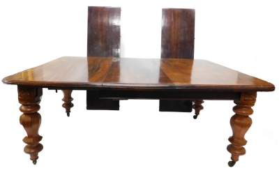 A Victorian mahogany extending dining table, the rectangular top with a moulded edge, on bulbous part turned octagonal legs with brass castors, five loose leaves, 71cm high, the top 135cm x 302cm. (winding mechanism and some aspects AF)