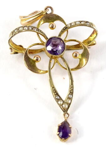 A 9ct gold amethyst pendant, with central stone and various circles and ovals, embellished with seed pearls, with later pin attached, stamped to reverse S Bros 9ct gold, 2.8g all in.