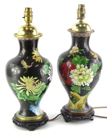 Two similar oriental cloisonne vases, each decorated with flowers, leaves, etc., converted to lamp bases, 43cm high.