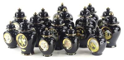 A large quantity of Chokin ware vases and covers, each decorated with flowers etc., embellished in 22ct and 24ct gold, on a black ground.