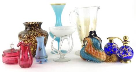 A collection of art glass etc., to include a handbag shaped vase, a centrepiece with a white opaque bowl, a lemonade glass, a jug, a brown mottled vase, two Bohemian scent bottles, etc.