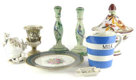 A collection of ceramics, to include a T and G Green Cornishware striped milk jug, a pair of Swedish art pottery candlesticks decorated with birds (AF), a German porcelain centrepiece decorated with putti in a barrel (AF), a Limoges plate, a Capodimonte 