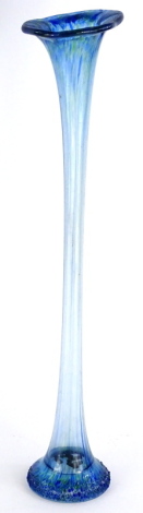 A continental art glass trumpet shaped slender vase, with mottled green and blue decoration, 56cm high.