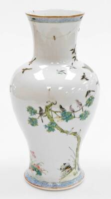 A Chinese porcelain vase, of baluster from decorated with birds, flowers and trees, in orange, blue and green, with six character red Qianlong mark to underside, 33cm high. (AF-repaired) - 3