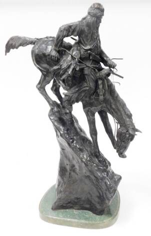 After Frederic Remington (1861-1906). Mountain man, a bronze sculpture of mounted Native American figure, signed and dated 1903, on a green marble plinth, 76cm high.