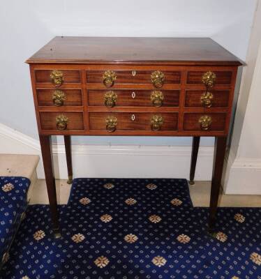 A George IV mahogany enclosed dressing table, the rectangular top with a moulded edge enclosing a fitted interior with a central adjustable mirror and various lidded compartments and recesses, the front with an arrangement of seven false drawers and doubl - 2