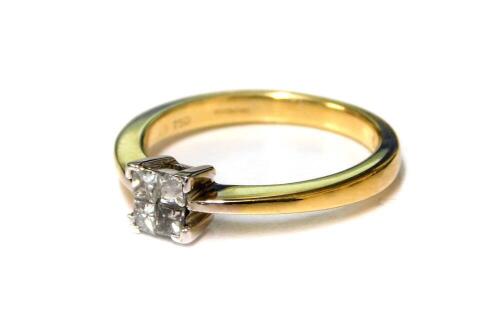 An 18ct gold and diamond four stone ring, set with princess cut diamonds in a square claw setting, approx 1/4 carat, size K, 3.5g.