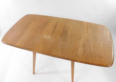 An Ercol Model 492 Windsor elm and beech square drop leaf dining table, raised on tapering splayed legs, 71cm high, 60.5cm wide, 135cm extended, 73.5cm deep. Auctioneer Note: The net proceeds from the sale of this lot will be donated to The Diana Award ch - 3