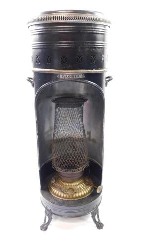 A Rippingille's of Birmingham Gloria stove, No 87., of cylindrical blackened tin and brass form, 88cm high, 33cm diameter.