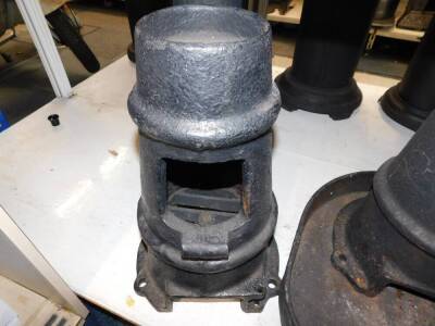 Three cast iron multi fuel burners, of chimney form, one with a base stand, 48cm high. (4) - 2