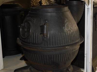 A Masport Yukon late 19thC cast iron pot belly stove, of fluted globe form, raised on an iron base and three cabriole legs, 58cm high, 34cm diameter. - 2