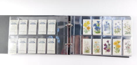 Cigarette cards, comprising six full sets; Wills's Russian Architecture., Alpine Flowers., Flags of the Empire, first and second series., Lambert & Butler British Trees and Their Uses., and Wills's Royalty.