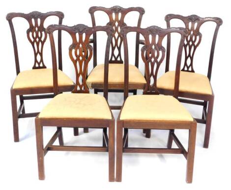 A set of five Chippendale style mahogany dining chairs, early 20thC, with leaf carved crest rail, pierced and carved vase shaped splat, drop in seat, raised on square legs united by an H framed stretcher, comprising carver and four single chairs. (5)