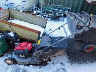 A Honda HRD536 petrol lawnmower, with three speed and self propelled rear roller.