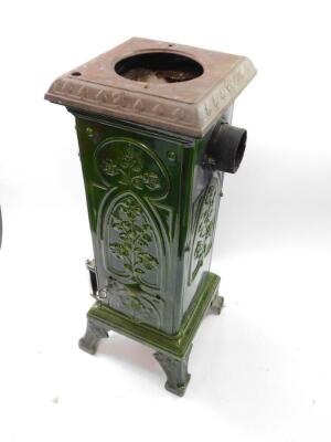 A Nestor-Martin Derby late 19thC cast iron and enamel stove, of rectangular column form, moulded with flowers, with a polished white metal door, raised on four scroll feet, 91cm high, 34cm wide, 32cm deep. - 4