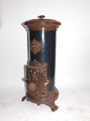 A Godin 20thC cast iron enamel and tin wood burning stove, of cylindrical form, raised on three scroll feet, 80cm high, 24cm diameter.