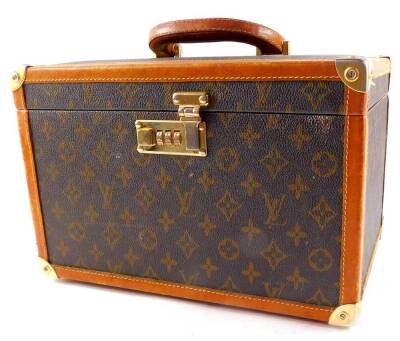 A Louis Vuitton style combination jewellery case, with tan leather trim, 20.5cm high, 32cm wide, 22cm deep.