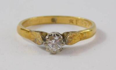 An 18ct gold and diamond solitaire ring, high claw set, approx 1/4ct, size K, 2.1g, - 2