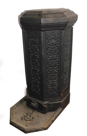 A late 19thC cast iron patio heater, of octagonal form, the pierced sides with floral and foliate motifs, raised on a hearth base, 65cm high, 33cm diameter.