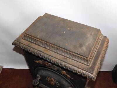 A French cast iron late 19thC stove, with a hinged lid, rectangular body and shaped hearth with pierced fender, 76cm high, 46cm wide, 31.5cm deep. - 2