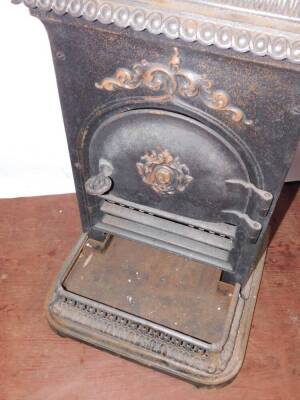 A French cast iron late 19thC stove, with a hinged lid, rectangular body and shaped hearth with pierced fender, 76cm high, 46cm wide, 31.5cm deep. - 3