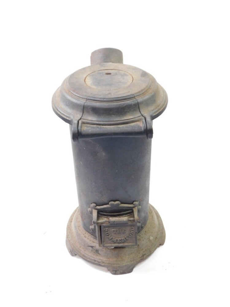 A cast iron cylindrical wood burning stove 