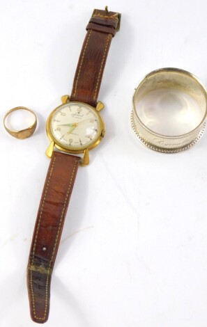 A lady's 9ct gold signet ring, size N/O, 2.4g, together with an Accurist gentleman's gold plated cased wristwatch, circular silvered dial bearing Arabic numerals at evens, centre seconds, 21 jewelled movement, No 979933, on a leather strap, and a Victoria