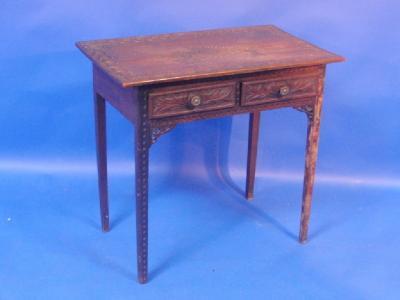 A 19thC carved oak hall table with two frieze drawers