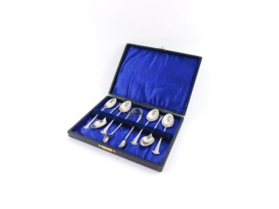 A set of six Edward VII silver teaspoons and a pair of sugar tongs, cased, London 1903, 2.48oz.