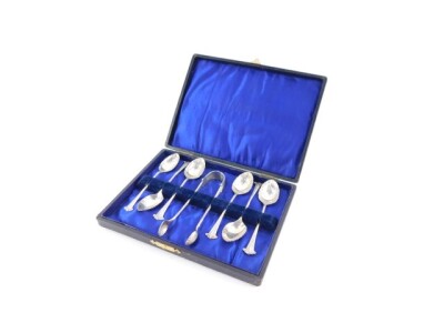 A set of six Edward VII silver teaspoons and a pair of sugar tongs, cased, London 1903, 2.48oz. - 2